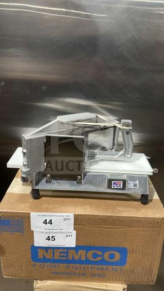 Brand new Nemco 55600-1 commercial countertop tomato slicer with stainless steel blades on legs, in box.