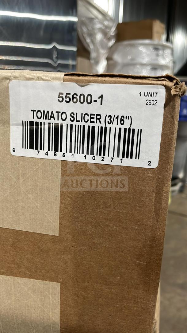 Nemco 55600-1 tomato slicer in box; new condition, 3 1/16" stainless steel blades, on legs, labeled packaging.