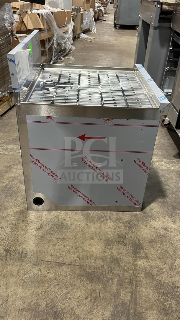 Brand new Perlick stainless steel underbar storage cabinet with drainboard top, on legs, protective film visible.