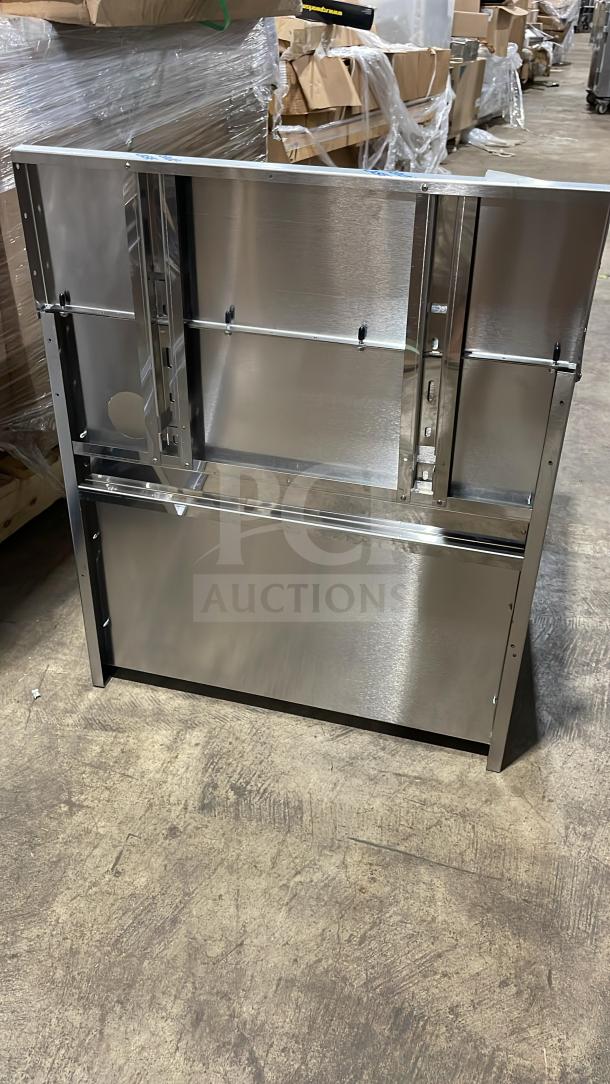 Brand new Perlick commercial stainless steel underbar storage cabinet with drainboard top, on legs, pristine condition.