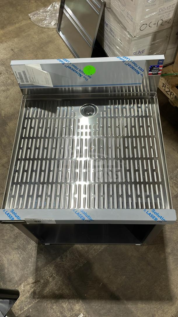 Perlick stainless steel underbar storage cabinet with drainboard top, new condition. On legs, protective film partially intact.
