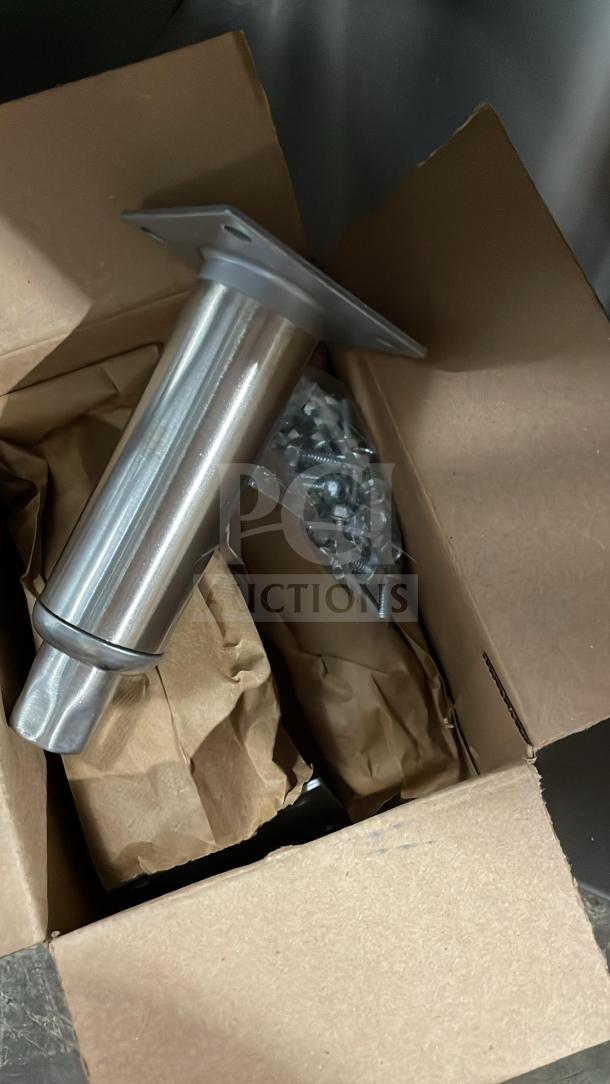 Brand new Perlick stainless steel underbar storage cabinet with drainboard top and legs, in packaging.