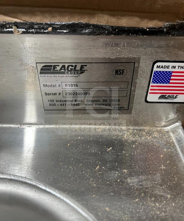 Eagle F1916 stainless steel floor-mounted mop sink, new in box. Features NSF marking, serial number 2302240999.