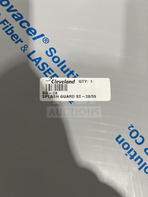Brand new Cleveland stainless steel sneeze guard, Model SG-28. Features protective covering. Manufacturer label visible.