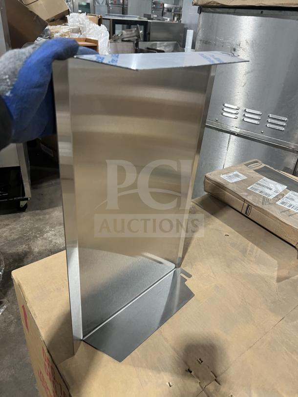 Cleveland Stainless Steel Sneeze Guard, Model SG-28, brand new, commercial grade, standing on cardboard in a warehouse.