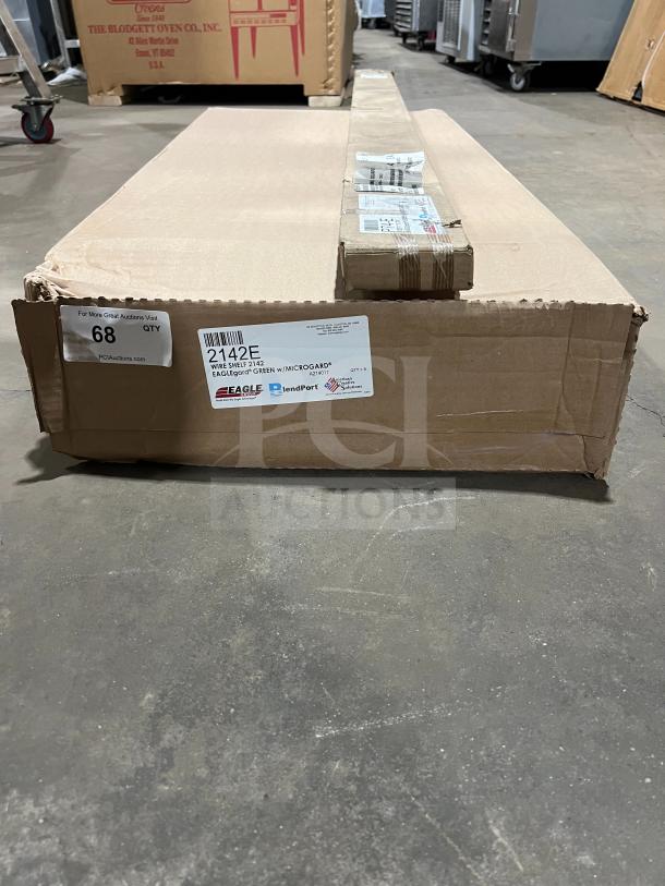 Brand new Eagle 2142E 21"x42" epoxy wire shelf in box. Includes stationary post. Labels show model details and shipping info.