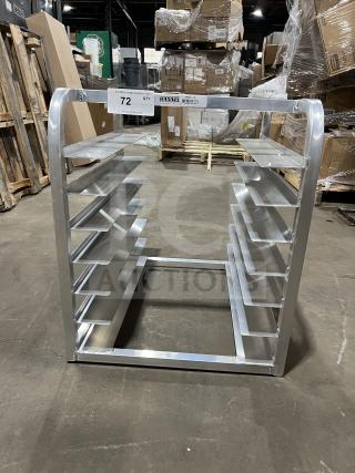 Brand new commercial half-size end load Bunn/pan rack. Aluminum frame, multiple shelves, pristine condition, item label "72".