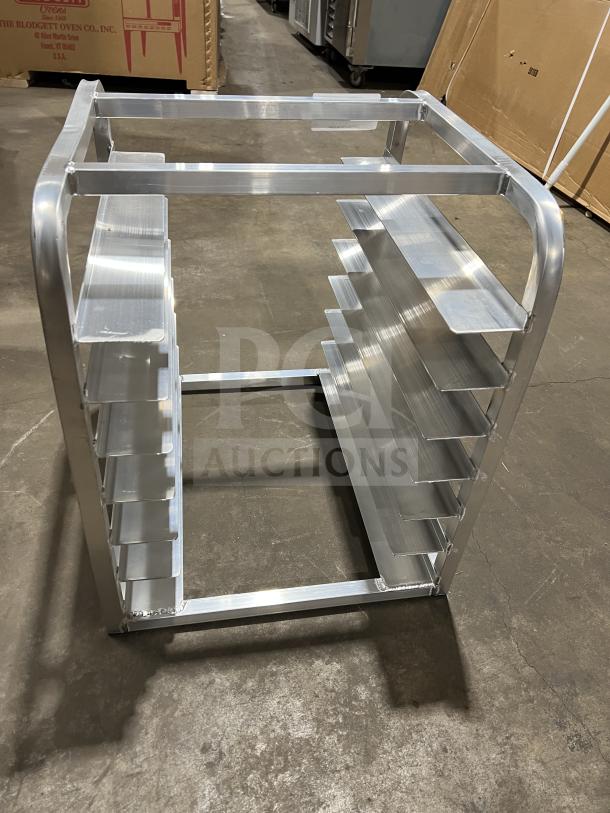 Brand new commercial half-size end load Bunn/pan rack. Features durable metal construction with multiple slots.