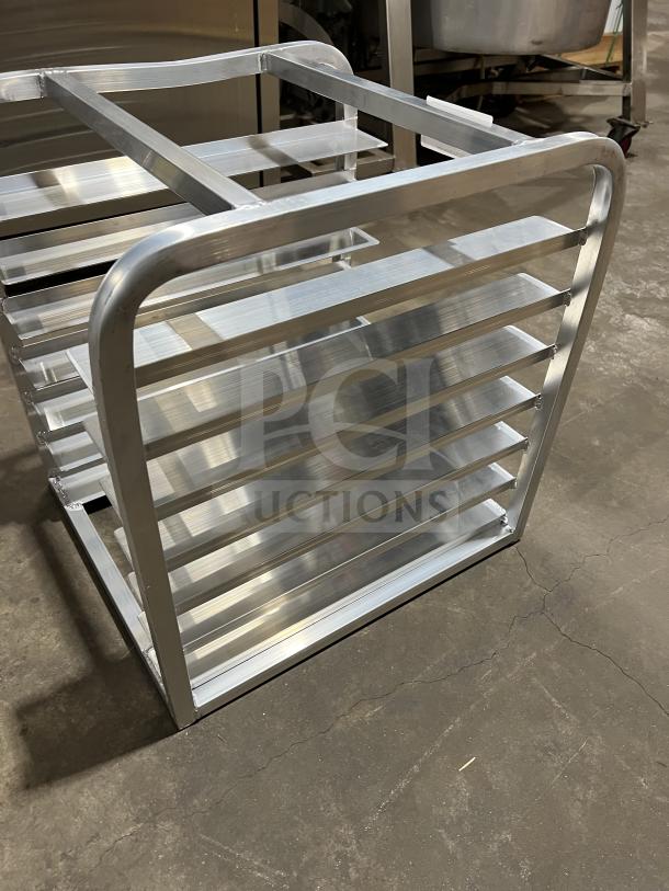 Brand new commercial half-size end load Bunn/Pan rack, aluminum construction, multiple shelves, pristine condition.
