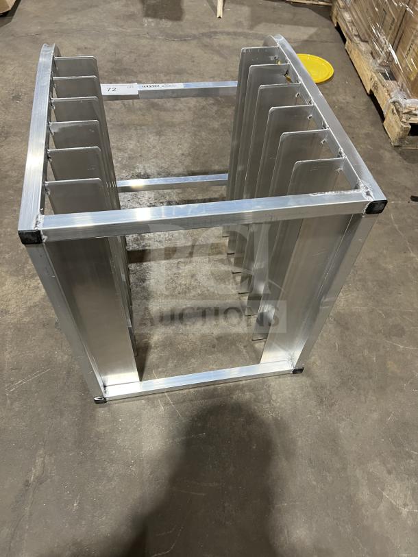 Brand new commercial half-size end load Bunn/pan rack, aluminum construction, with multiple slots, excellent condition.