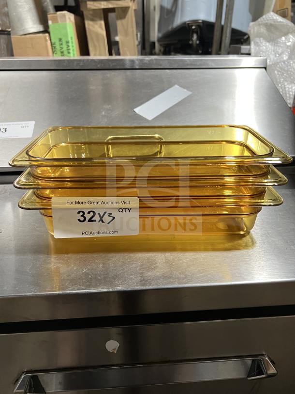Brand new Cambro 32HP 1/3 size high heat polycarbonate food pan, stack of three, with auction label "32X3 QTY".