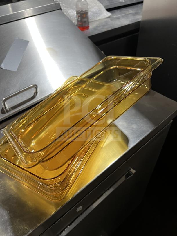 Brand new Cambro 32HP polycarbonate high heat food pan, 1/3 size, amber color, in pristine condition.
