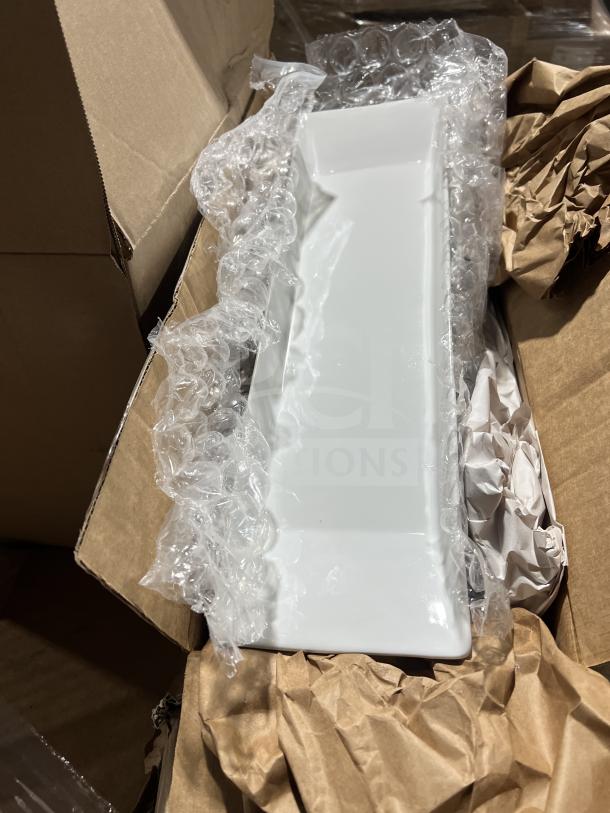 Brand new mixed pallet with Casa Nova black serving plates, model OP331, and other commercial kitchen items in packaging.