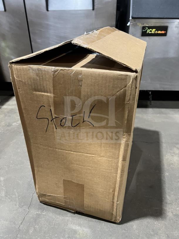 Cardboard box containing a new Bloomfield Koffee King Series commercial coffee brewer, model 48-8542-D1-120V. Marked as "Stock".