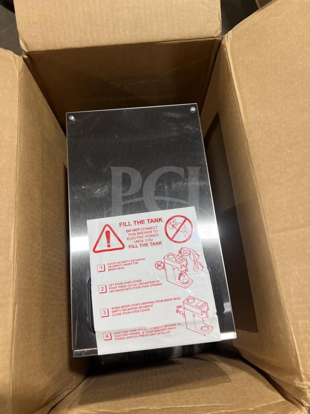 Brand new Bloomfield Koffee King stainless steel coffee brewer in box. Model 48-8542D1120V, includes brew basket.