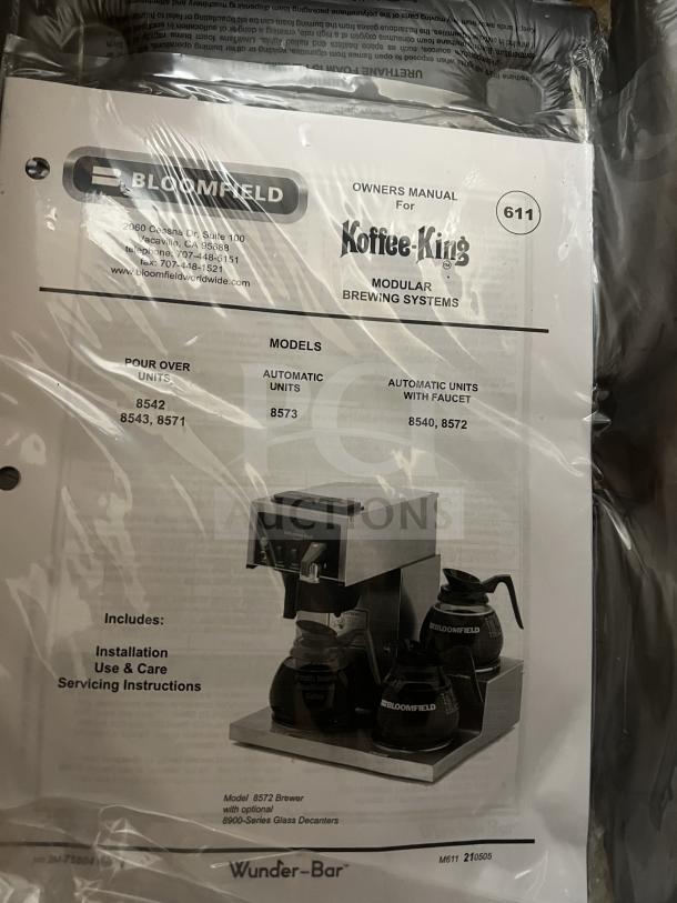 Brand new Bloomfield Koffee King Series coffee brewer, stainless steel, model 48-8542-D1-120V, with brew basket and manual.