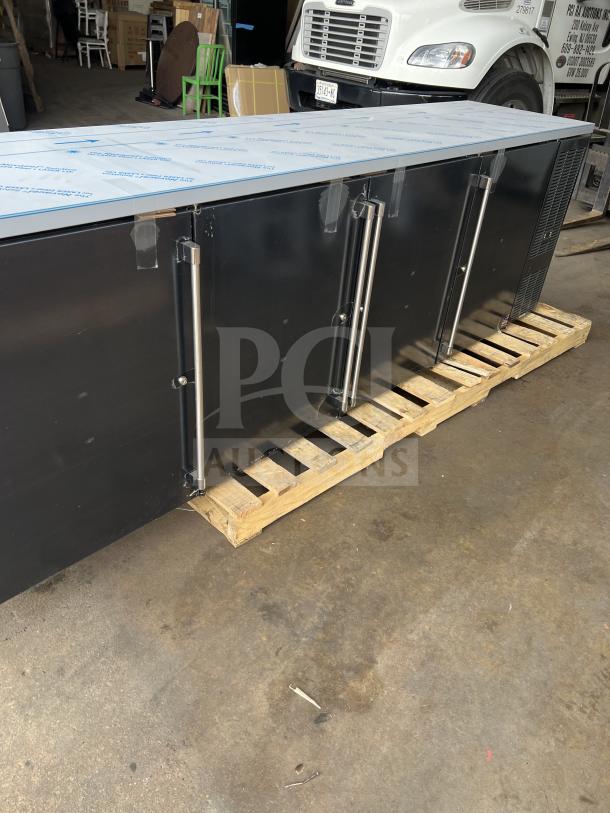 Brand new Perlick 4-door bar back refrigerator, model BBS108-RF-Y-S-S-H1, with black finish, stainless steel worktop.