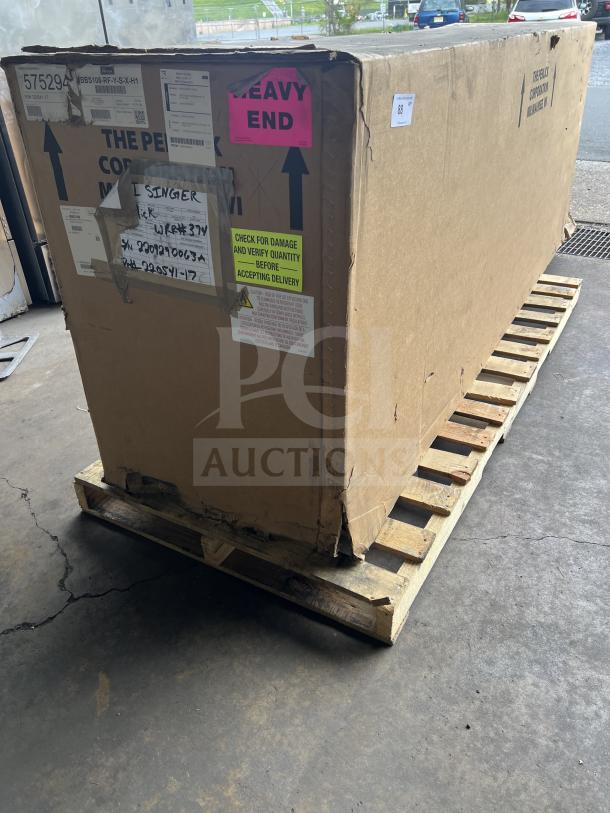 Brand new Perlick 4-door bar back refrigerator, Model BBS108RFYSSH1, in sealed box on pallet. Includes stainless steel worktop and wired rack.