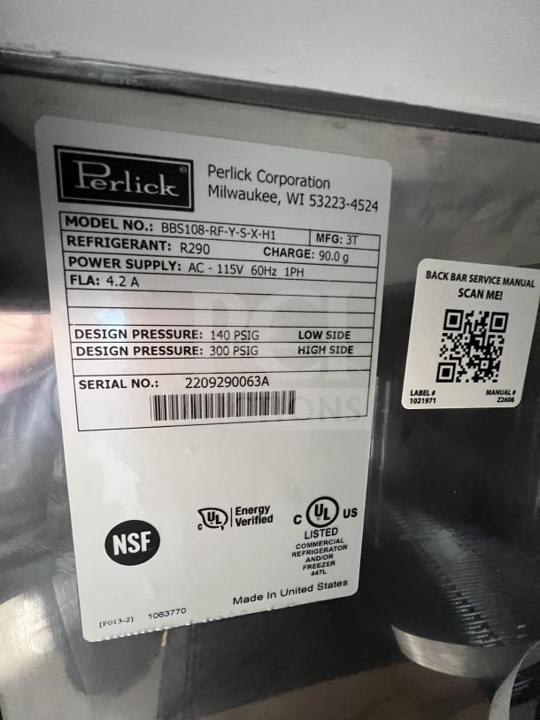 Perlick 4-Door Bar Back Refrigerator, model BBS108RFYSSH1, new in box. Includes stainless steel worktop, wired rack. SN: 2209290063A.