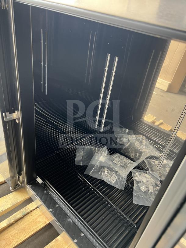 Brand new Perlick commercial black 4-door bar back refrigerator, model BBS108RFYSSH1, with stainless worktop and wired rack.