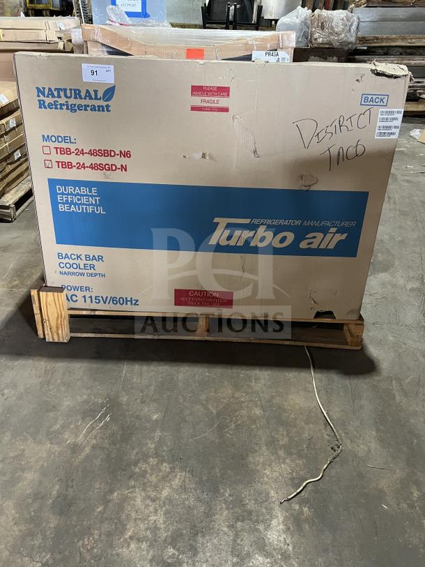 New Turbo Air TBB-24-48SGD-N Bar Cooler in box. Black, 2-glass door, stainless steel worktop, 110-120V, 1 Phase.