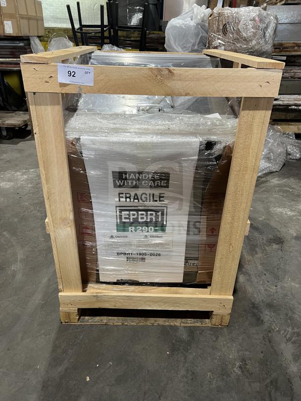 Brand new Everest EPBR1 prep table in box, stainless steel, with food pans, refrigerated base, and casters, 115V, 1-phase.