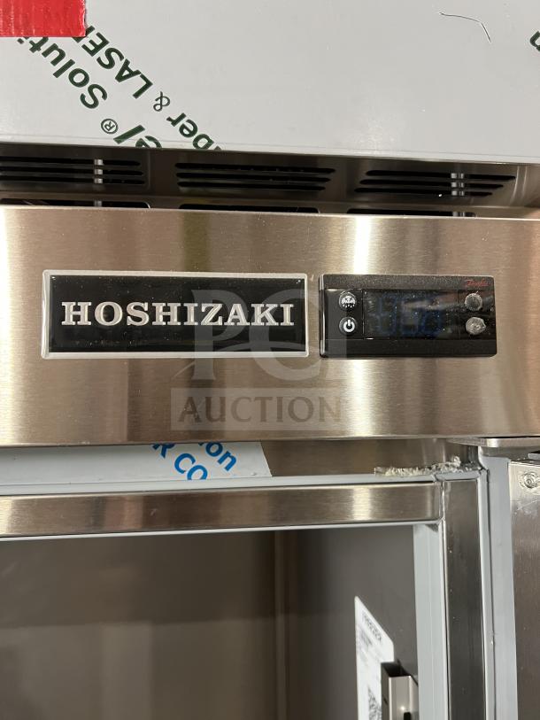 Brand new Hoshizaki commercial stainless steel one door reach-in freezer, model F1A-FS, features wired racks and digital display.