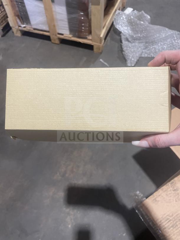 Brand new pallet of 12 boxes of commercial cardboard take-out boxes. Unopened, stacked on wooden pallet, photographed in warehouse.