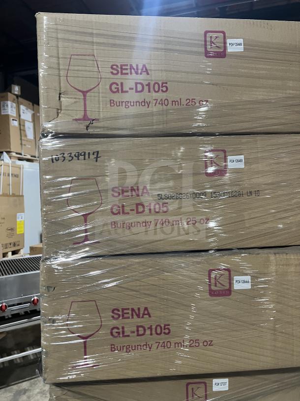 Mixed pallet with 91 boxes of dinner plates, 3 boxes of 1 oz ramekins, 12 boxes of 8 oz side dishes, 12 boxes of melamine display plates, 8 boxes of Bauscher 30 cm plates, and 6 boxes of Korin Sena 625 ml wine glass sets, models 8431, GAN-552-AC7A, ML-244-BK, and GL-D104. Labels show "SENA GL-D105, Burgundy 740 ml. 25 oz."