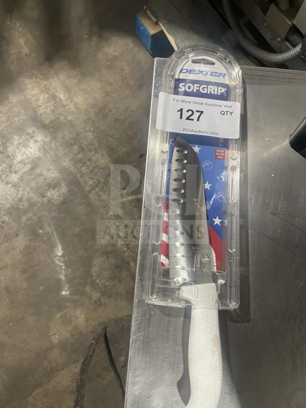 Brand new Dexter Russell SofGrip 7" Santoku knife, model SG144-7GE-PCP, with white grip handle in original packaging.