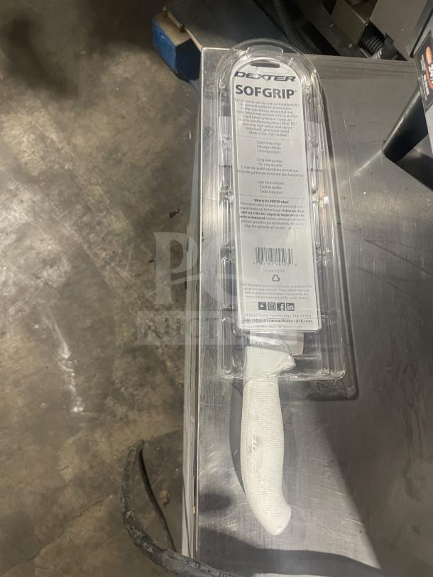 Brand new Dexter Russell SofGrip 7" Santoku knife, model SG144-7GE-PCP, with white grip handle in packaging.