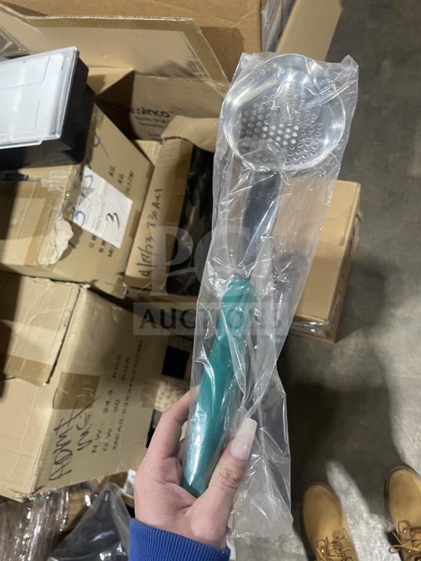 Brand new Vollrath 6 oz oval perforated spoodle, model 64226, stainless steel, teal nylon handle, in packaging.