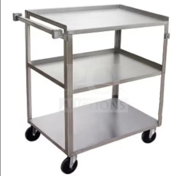 Brand new Vollrath 3-tier stainless steel kitchen utility cart, includes handles and casters for easy mobility.