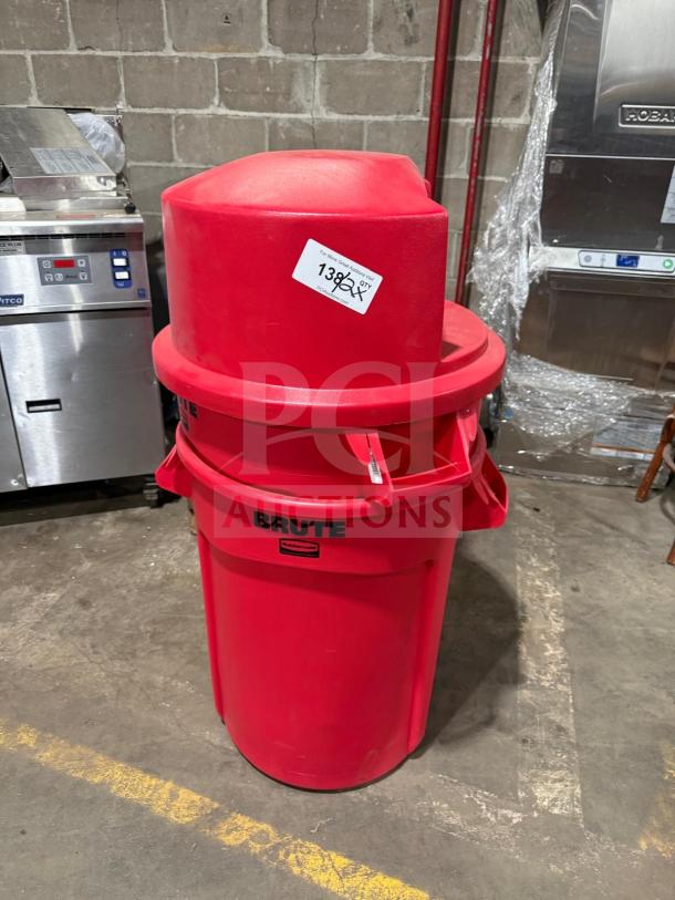 Brute heavy-duty red poly trash can with dome push cover, new condition, visible label, auction lot number 138.