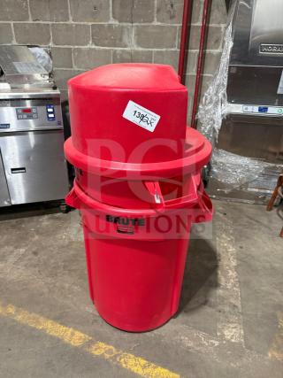 Brute heavy-duty red poly trash can with dome push cover, new condition, visible label, auction lot number 138.