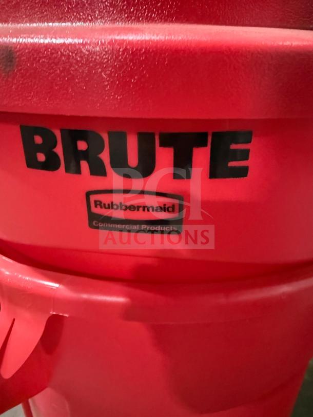 Red Brute heavy-duty poly trash can, new condition, labeled Rubbermaid Commercial, includes dome push cover.