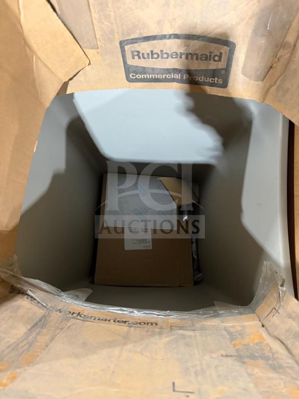 New Rubbermaid Poly Trash Container in original packaging. Brand label visible, indicating commercial use.
