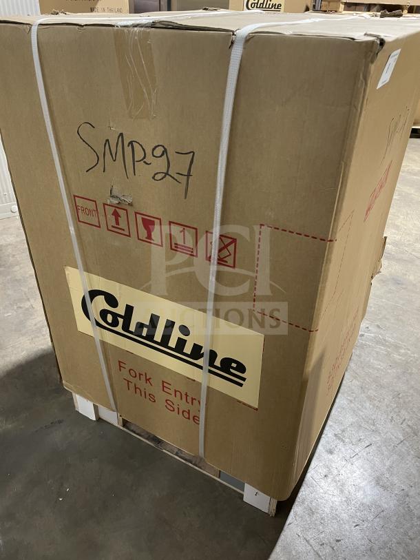 Brand new Coldline SMP27 refrigerated prep table in box, model SMP-27, serial 976655966, on casters.