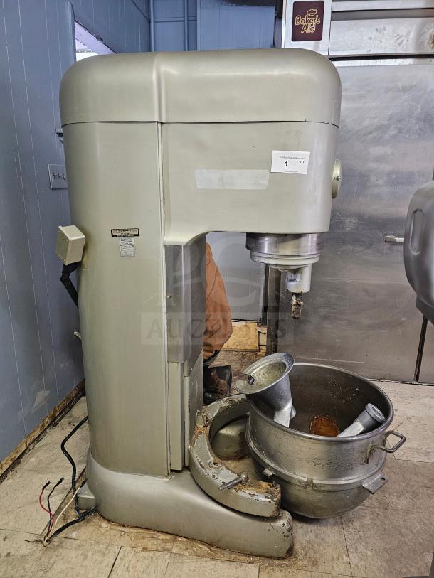 HOBART N-802 80Qt commercial mixer in used condition, includes attachments, 230 volts, visible wear and markings.