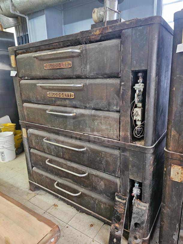 Blodgett 981 Natural Gas Double Deck Oven, worn condition, visible wear and patina, sturdy handles, industrial-grade.