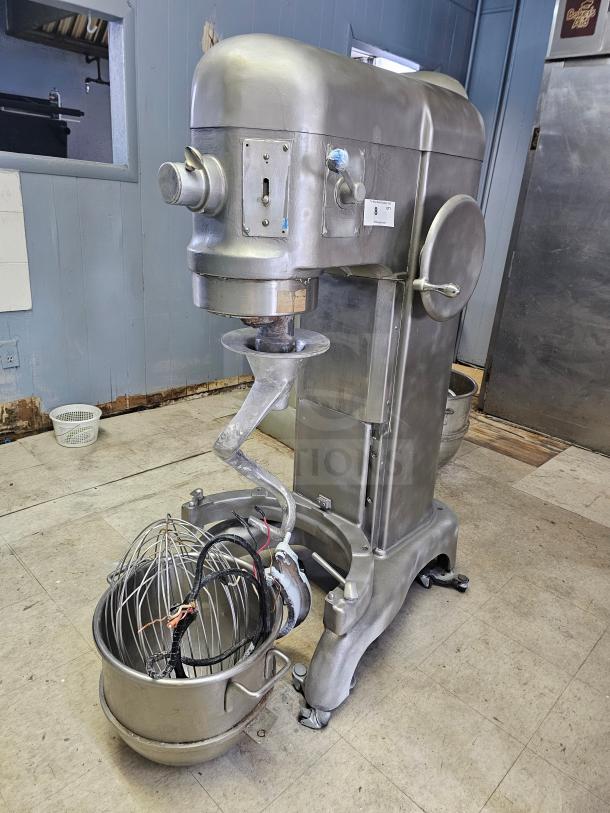 Hobart 60Qt commercial mixer with attachments, stainless steel, in good condition, includes bowl, whisk, and paddle.