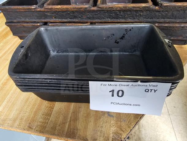 Black baking pan stack, used condition, rectangular shape, auction label indicating quantity of 10.