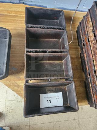 Rustic 4-strap bread loaf pan with visible wear and patina, rectangular compartments. Auction tag with "11" and "QTY 2."