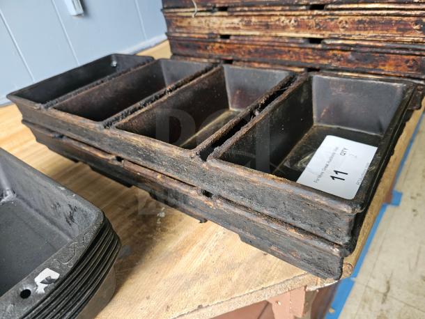Vintage 4-strap bread loaf pan, metal construction, shows signs of wear, auction label with "11 QTY" visible.