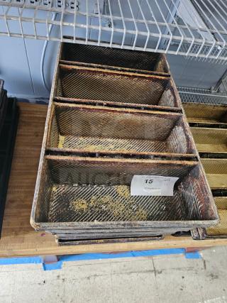 Rectangular metal baking pan with three sections, showing signs of wear and rust. Auction tag number 15 attached.