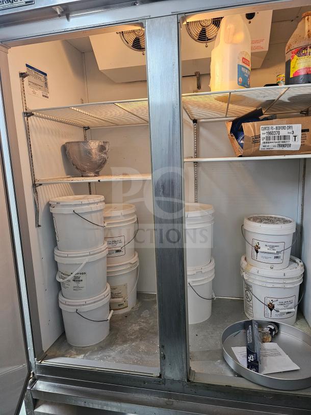 Beverage-Air KR48-1AS refrigerator, two solid doors, spacious interior, includes labels and storage shelves, used condition.