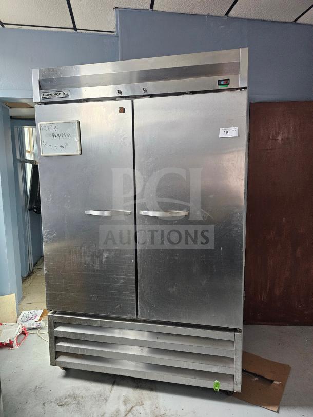 Beverage-Air KR48-1AS refrigerator, 2 solid doors, stainless steel, visible wear, energy reading, note: "Please Keep Clean."