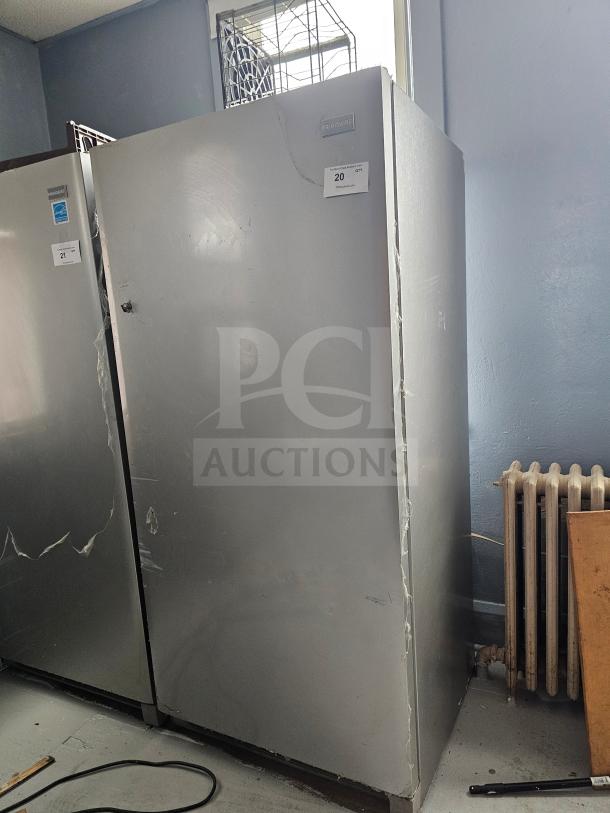 FRIGIDAIRE single door freezer, silver, missing handle, visible dents and scratches. Label reads: "20 Qty #usedcommercial".