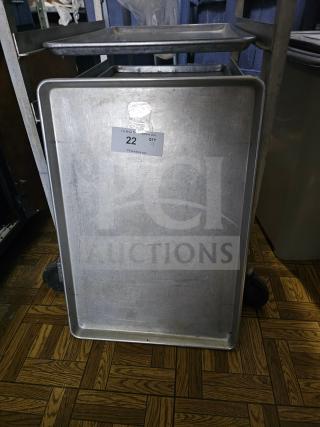 Full-size metal baking pan, used, with visible wear. Auction label showing "22" and quantity "9" from PCI Auctions.