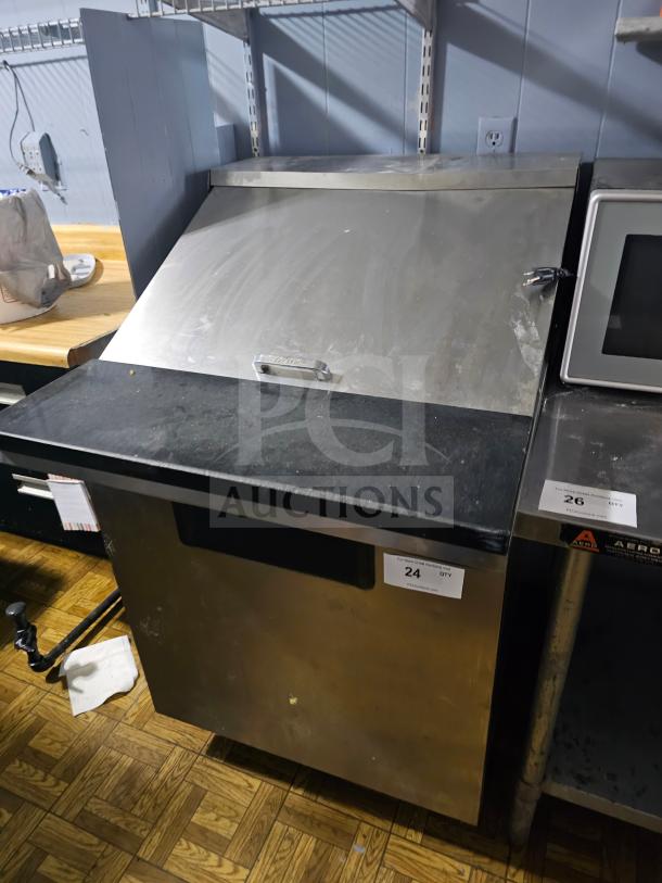 TRUE TWT-27 Single Door Sandwich Table, stainless steel, used condition, with manufacturer's logo on the handle.